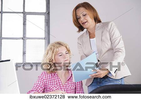Boss in conversation with a trainee View Large Photo Image Stock Photo - Boss in conversation with a trainee. Fotosearch
