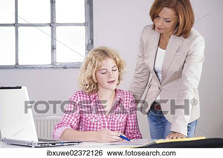 Boss in conversation with a trainee View Large Photo Image Stock Photograph - Boss in conversation with a trainee. Fotosearch