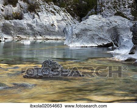 "Boulders and rocks in the river bed of the golden coloured Soca river in Soca Valley near Bovec, Triglav National Park, Slovenia, Europe" View Large Photo Image Stock Image - "Boulders and rocks in the river bed of the golden coloured Soca river in Soca Valley near Bovec, Triglav National Park, Slovenia, Europe". Fotosearch