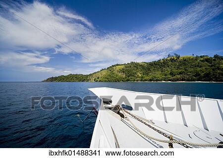 "Bow of a boat in front of tropical landscape, Sulawesi, Indonesia, Southeast Asia, Asia" View Large Photo Image Stock Image - "Bow of a boat in front of tropical landscape, Sulawesi, Indonesia, Southeast Asia, Asia". Fotosearch