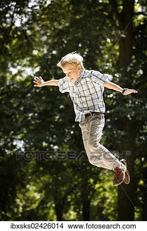 "Boy, 10 years, playground, jumping down from playground equipment" View Large Photo Image Picture - "Boy, 10 years, playground, jumping down from playground equipment". Fotosearch