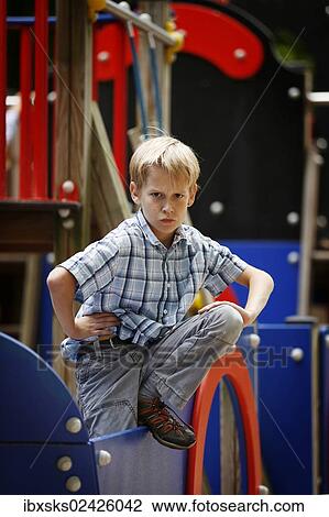 "Boy, 10 years, playground, posing on a toy boat" View Large Photo Image Stock Image - "Boy, 10 years, playground, posing on a toy boat". Fotosearch