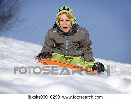 "Boy, 11 years, sledging" View Large Photo Image Stock Image - "Boy, 11 years, sledging". Fotosearch