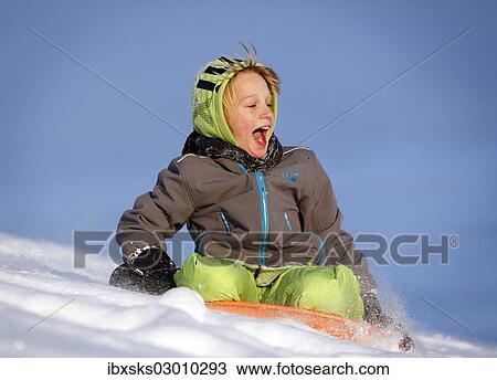 "Boy, 11 years, sledging" View Large Photo Image Stock Image - "Boy, 11 years, sledging". Fotosearch