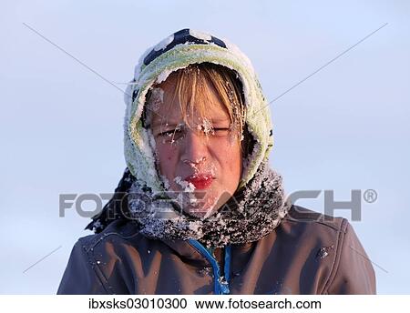 "Boy, 11 years, with snow on his face and hood, pulling a face" View Large Photo Image Stock Image - "Boy, 11 years, with snow on his face and hood, pulling a face". Fotosearch