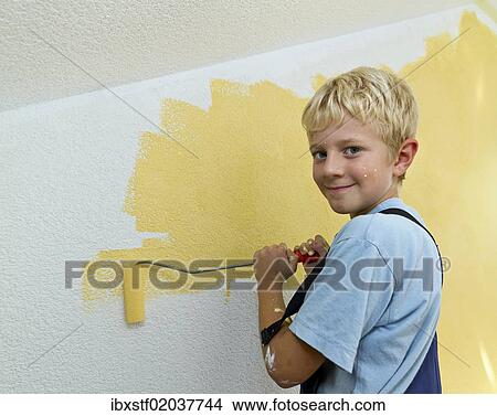 "Boy, 8 years, painting a wall" View Large Photo Image Picture - "Boy, 8 years, painting a wall". Fotosearch