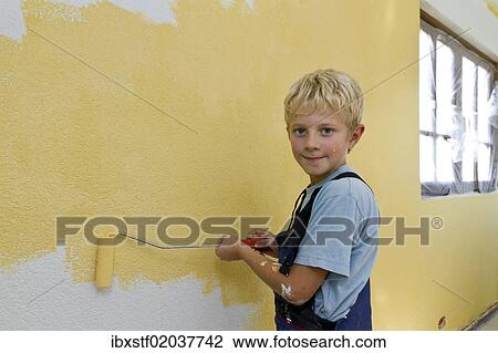 "Boy, 8 years, painting a wall" View Large Photo Image Stock Image - "Boy, 8 years, painting a wall". Fotosearch