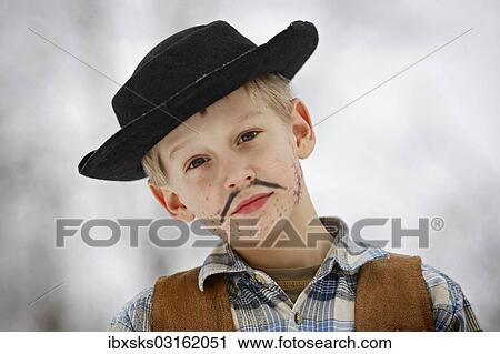 "Boy dressed as a cowboy during carnival, portrait" View Large Photo Image Stock Image - "Boy dressed as a cowboy during carnival, portrait". Fotosearch