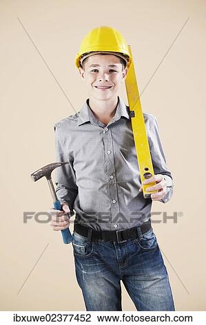 Boy dressed as a craftsman or workman View Large Photo Image Stock Image - Boy dressed as a craftsman or workman. Fotosearch