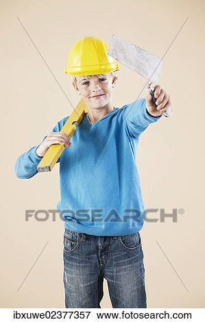 Boy dressed as a craftsman or workman View Large Photo Image Stock Photo - Boy dressed as a craftsman or workman. Fotosearch