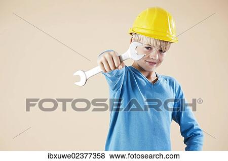 Boy dressed as a craftsman or workman View Large Photo Image Stock Photo - Boy dressed as a craftsman or workman. Fotosearch