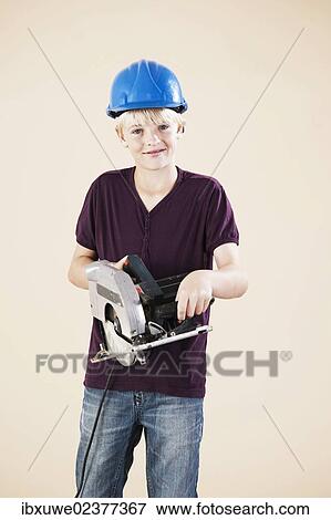 Boy dressed as a craftsman or workman View Large Photo Image Stock Photo - Boy dressed as a craftsman or workman. Fotosearch