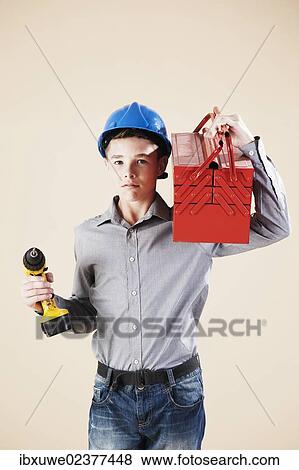 Boy dressed as a craftsman or workman View Large Photo Image Stock Photo - Boy dressed as a craftsman or workman. Fotosearch