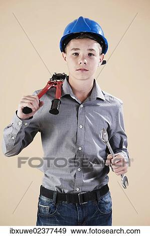 Boy dressed as a craftsman or workman View Large Photo Image Stock Photo - Boy dressed as a craftsman or workman. Fotosearch