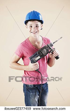 Boy dressed as a craftsman or workman View Large Photo Image Stock Photo - Boy dressed as a craftsman or workman. Fotosearch