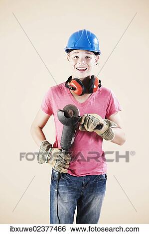 Boy dressed as a craftsman or workman View Large Photo Image Stock Photograph - Boy dressed as a craftsman or workman. Fotosearch