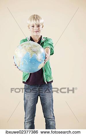 Boy holding a globe View Large Photo Image Stock Photograph - Boy holding a globe. Fotosearch