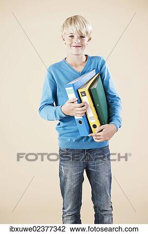 Boy holding folders View Large Photo Image Stock Image - Boy holding folders. Fotosearch