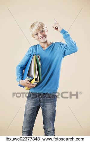 Boy holding folders View Large Photo Image Stock Photo - Boy holding folders. Fotosearch