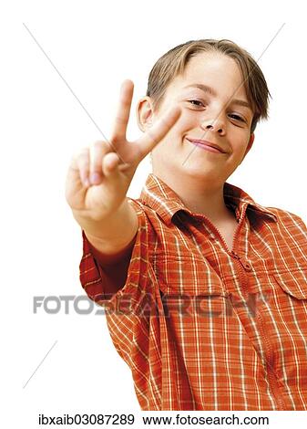 "Boy, smiling, making a V-sign" View Large Photo Image Stock Photo - "Boy, smiling, making a V-sign". Fotosearch