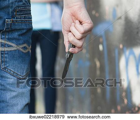 Boy threatening a girl with a knife View Large Photo Image Stock Photo - Boy threatening a girl with a knife. Fotosearch