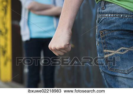 Boy threatening a girl with his fist View Large Photo Image Stock Image - Boy threatening a girl with his fist. Fotosearch