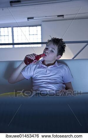 Boy watching television View Large Photo Image Stock Photograph - Boy watching television. Fotosearch