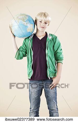 Boy with a globe on his shoulders View Large Photo Image Stock Photo - Boy with a globe on his shoulders. Fotosearch