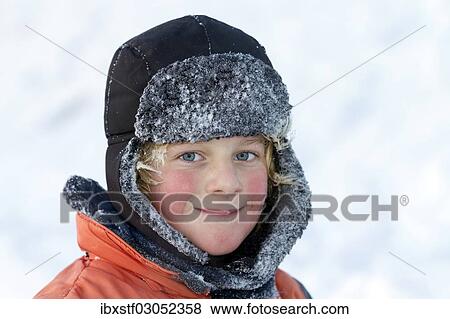 "Boy with a hat in winter, portrait" View Large Photo Image Stock Photo - "Boy with a hat in winter, portrait". Fotosearch