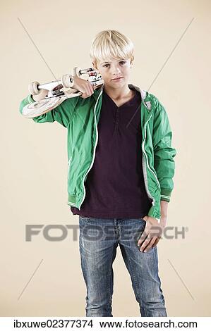 Picture - Boy with a skateboard. Fotosearch