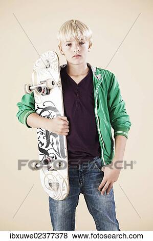 Boy with a skateboard View Large Photo Image Stock Photo - Boy with a skateboard. Fotosearch