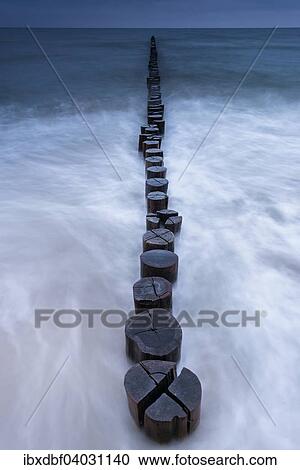 "Breakwaters or groins, blue hour, Baltic Sea, Zingst Fischland-Darss-Zingst peninsula, Mecklenburg-Western Pomerania, Germany, Europe" View Large Photo Image Stock Image - "Breakwaters or groins, blue hour, Baltic Sea, Zingst Fischland-Darss-Zingst peninsula, Mecklenburg-Western Pomerania, Germany, Europe". Fotosearch