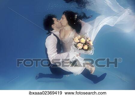 "Bridal couple, underwater wedding in pool, Odessa, Ukraine, Eastern Europe, Europe" View Large Photo Image Stock Photo - "Bridal couple, underwater wedding in pool, Odessa, Ukraine, Eastern Europe, Europe". Fotosearch