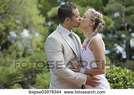 Picture - Bride and groom kissing. Fotosearch
