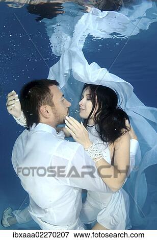 "Bride and groom, underwater wedding in a pool" View Large Photo Image Stock Photo - "Bride and groom, underwater wedding in a pool". Fotosearch