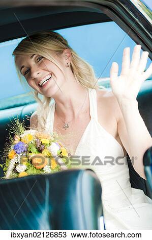 Bride in wedding car View Large Photo Image Stock Image - Bride in wedding car. Fotosearch