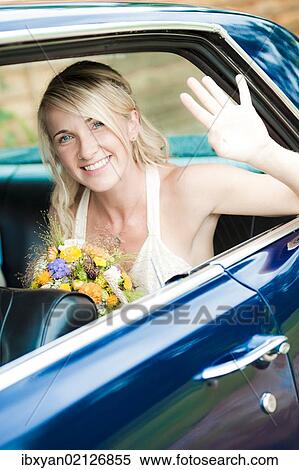 Stock Photography - Bride in wedding car. Fotosearch