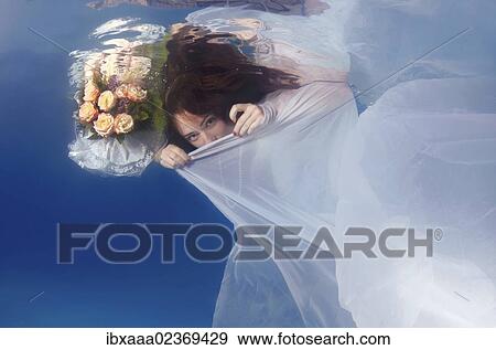 "Bride, underwater wedding in a pool, Odessa, Ukraine, Eastern Europe, Europe" View Large Photo Image Stock Photo - "Bride, underwater wedding in a pool, Odessa, Ukraine, Eastern Europe, Europe". Fotosearch