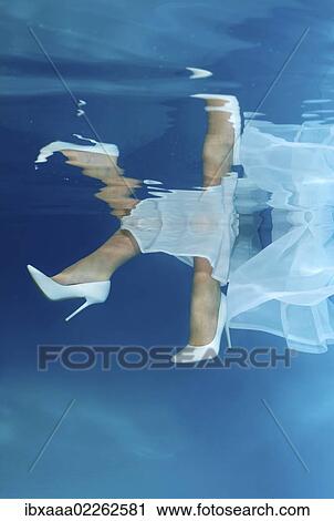"Bride's feet, underwater wedding in pool" View Large Photo Image Stock Image - "Bride's feet, underwater wedding in pool". Fotosearch