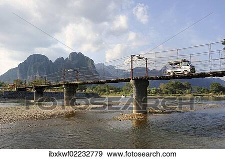 "Bridge across the Nam Song river, karst mountain range at the back, Vang Vieng, Laos, Southeast Asia, Asia" View Large Photo Image Stock Photo - "Bridge across the Nam Song river, karst mountain range at the back, Vang Vieng, Laos, Southeast Asia, Asia". Fotosearch