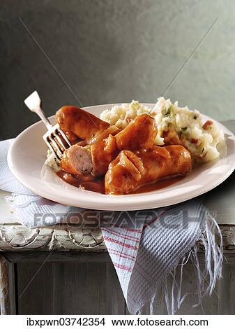 "British food, sausage, onion gravy and mashed potatoes" View Large Photo Image Picture - "British food, sausage, onion gravy and mashed potatoes". Fotosearch