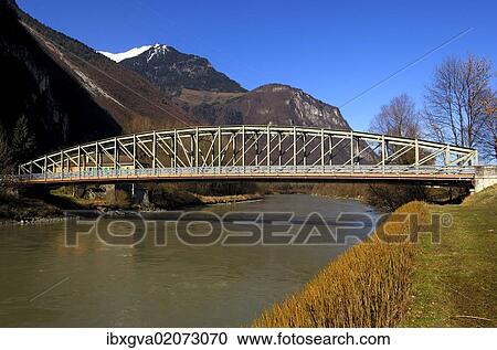 Stock Image - "Broadside of a steel bridge crossing Rhone River, near Chessel, Vaud, Switzerland, Europe". Fotosearch