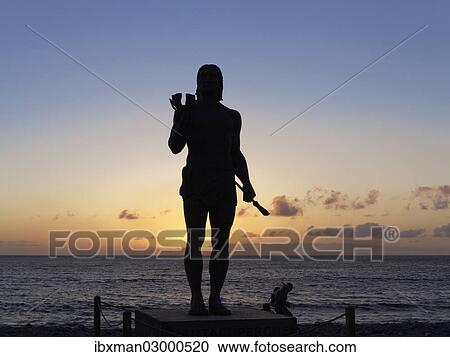 Stock Image - "Bronze statue, monument to the Guanche warrior, Hautacuperche, with backlighting, La Gomera, Valle Gran Rey, Canary Islands, Spain, Europe". Fotosearch