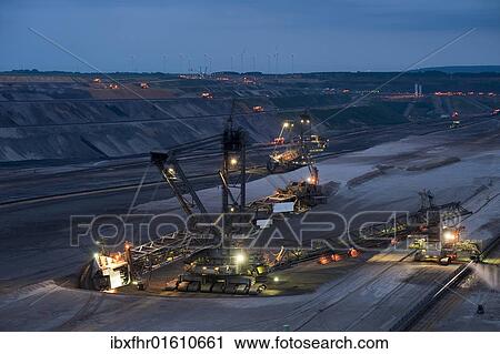 "Bucket-wheel excavator at the blue hour in an open pit, Grevenbroich, North Rhine-Westphalia, Germany, Europe" View Large Photo Image Stock Image - "Bucket-wheel excavator at the blue hour in an open pit, Grevenbroich, North Rhine-Westphalia, Germany, Europe". Fotosearch