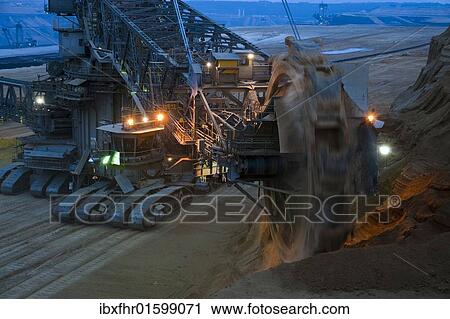 "Bucket-wheel excavator at work, Grevenbroich, North Rhine-Westphalia, Germany, Europe" View Large Photo Image Stock Image - "Bucket-wheel excavator at work, Grevenbroich, North Rhine-Westphalia, Germany, Europe". Fotosearch