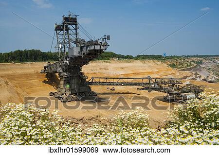 "Bucket-wheel excavator in an open pit, Grevenbroich, North Rhine-Westphalia, Germany, Europe" View Large Photo Image Stock Photo - "Bucket-wheel excavator in an open pit, Grevenbroich, North Rhine-Westphalia, Germany, Europe". Fotosearch