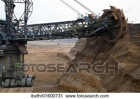 "Bucket-wheel excavator on the slope of the open pit, Grevenbroich, North Rhine-Westphalia, Germany, Europe" View Large Photo Image Stock Image - "Bucket-wheel excavator on the slope of the open pit, Grevenbroich, North Rhine-Westphalia, Germany, Europe". Fotosearch