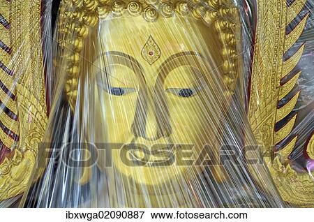 "Buddha statue covered with plastic foil, produced in a small factory, Bamrung Muang Road, Bangkok, Thailand, Asia, PublicGround, Asia" View Large Photo Image Stock Photo - "Buddha statue covered with plastic foil, produced in a small factory, Bamrung Muang Road, Bangkok, Thailand, Asia, PublicGround, Asia". Fotosearch