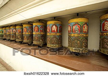 Stock Photo - "Buddhist prayer wheels on the exterior wall of the Swayambhunath Stupa Temple, also called Monkey Temple, Kathmandu, Nepal, Asia". Fotosearch