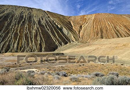 "Burden dumps with rain water channels, Kennecott Utah Copper's Bingham Canyon Mine, Copperton, Utah, USA" View Large Photo Image Stock Photograph - "Burden dumps with rain water channels, Kennecott Utah Copper's Bingham Canyon Mine, Copperton, Utah, USA". Fotosearch